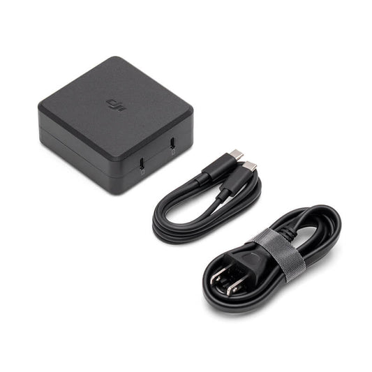 Black power adapter and charging cable on a white background
