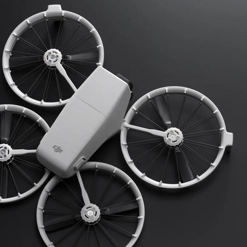 Model of a dji flip with large wheels on a dark background