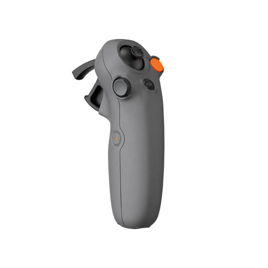 Gray handheld device with control knobs on a white background