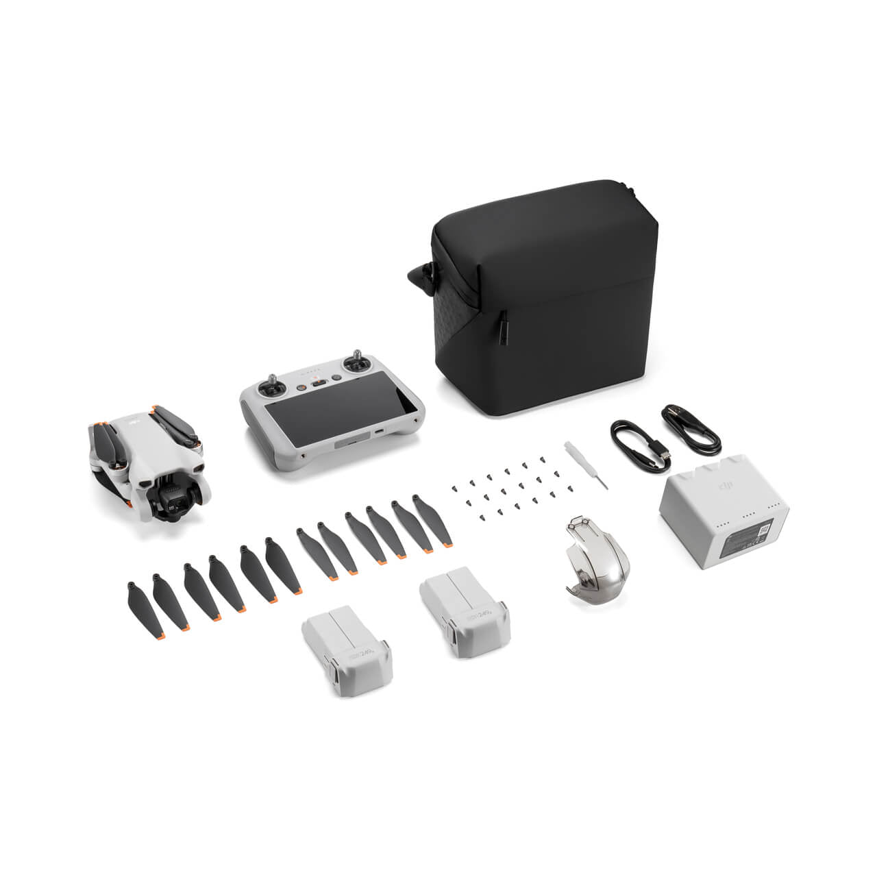 Collection of DJI Mini 3 Fly More Combo drone parts and accessories on a white background