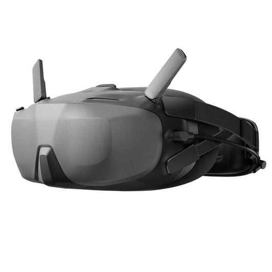 Black goggles with a reflective lens on a white background