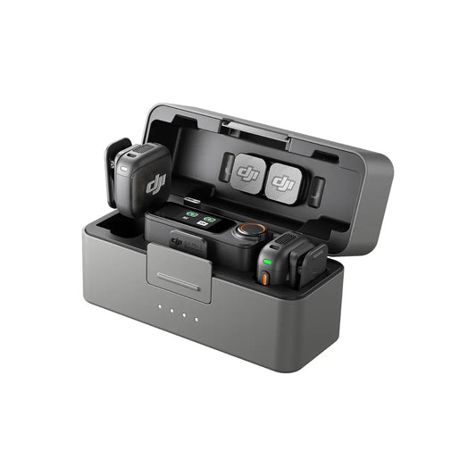 DJI Mic 3 charging station with battery and remote control on a white background