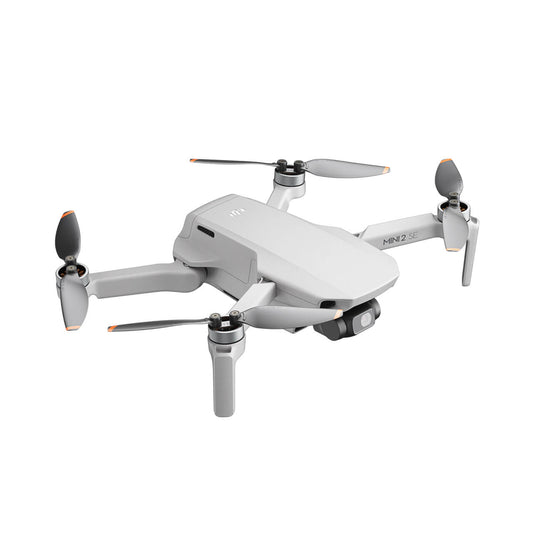 DJI Mini 2 SE drone with propellers on a white background