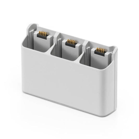 White electronic component with three connectors on a white background