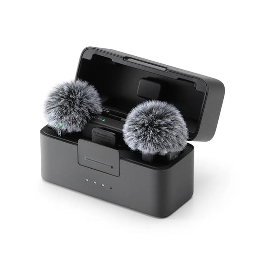 Black DJI Mic Mini microphone windscreen with two gray fluffy covers on a white background