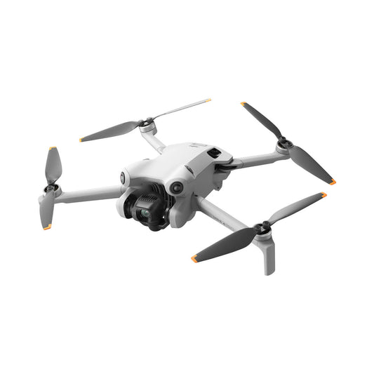 DJI mini 4 pro drone with four propellers on a white background