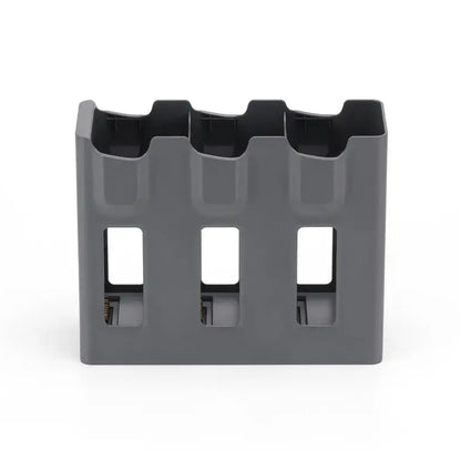 Gray plastic holder with multiple slots on a white background
