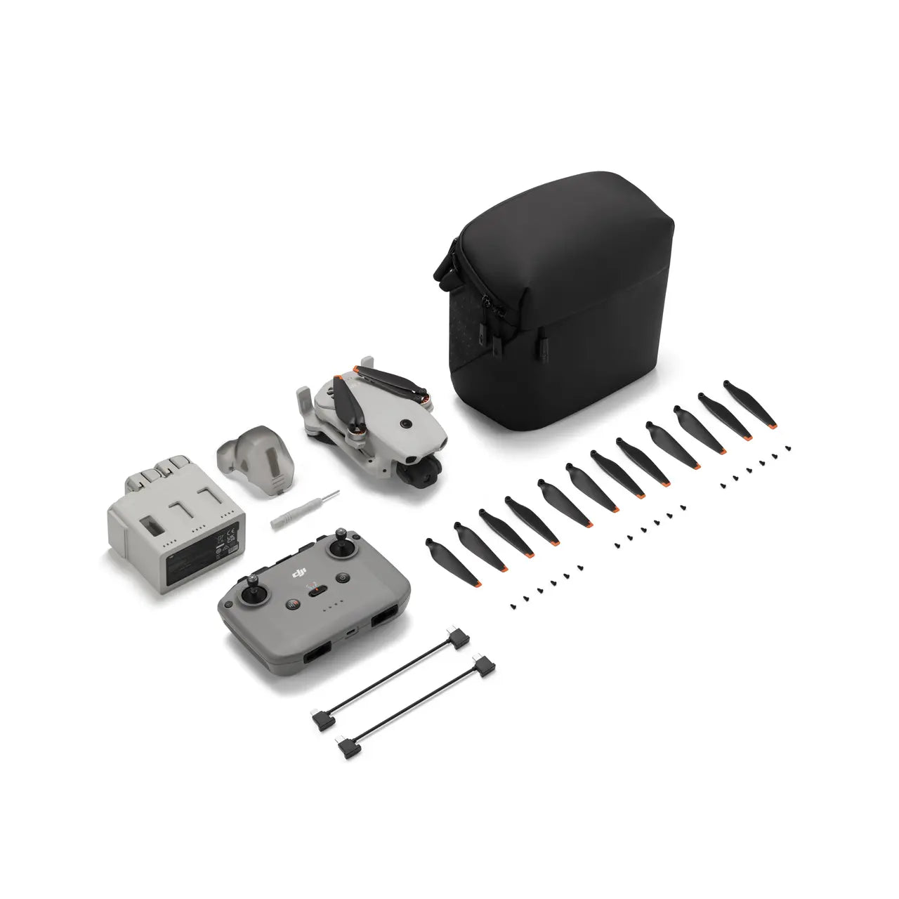 Drone components including body, propellers, and accessories on a white background