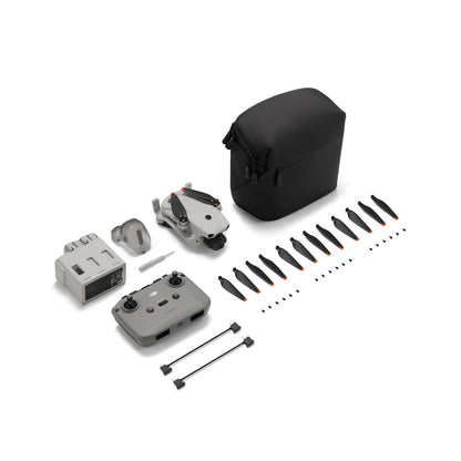 Drone components including body, propellers, and accessories on a white background