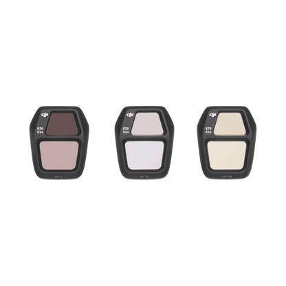Three filter holders with different color filters on a black background