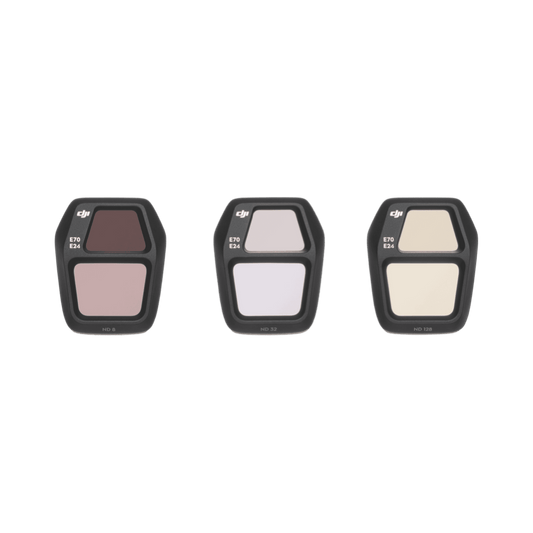 Three filter holders with different color filters on a black background