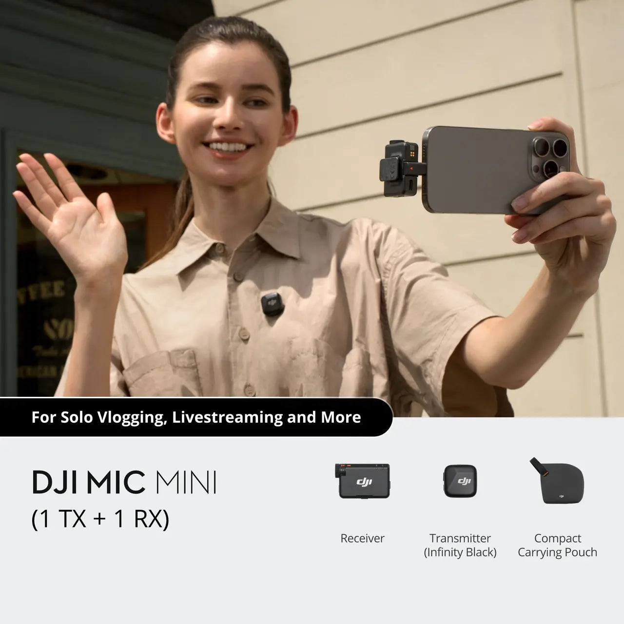 Person holding a smartphone with DJI Mic Mini attached, outdoors.