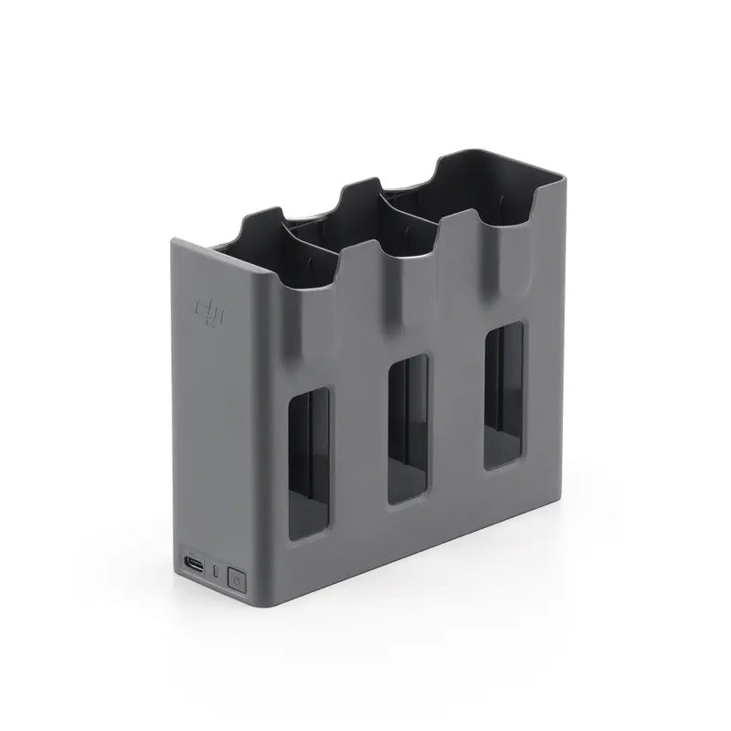Gray battery holder with multiple slots on a white background