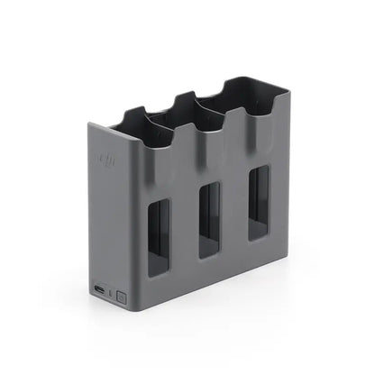 Gray battery holder with multiple slots on a white background