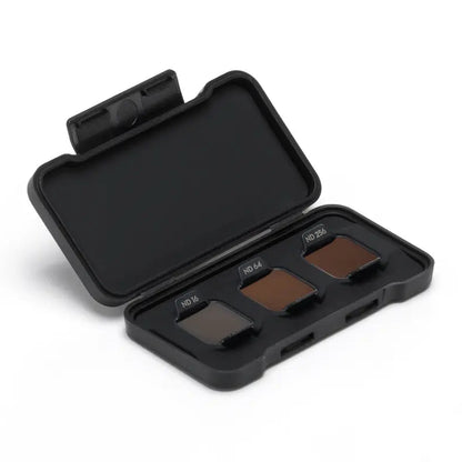 Black case with four brown filters on a white background