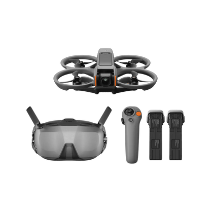Drone with goggles, remote control, and batteries on a white background