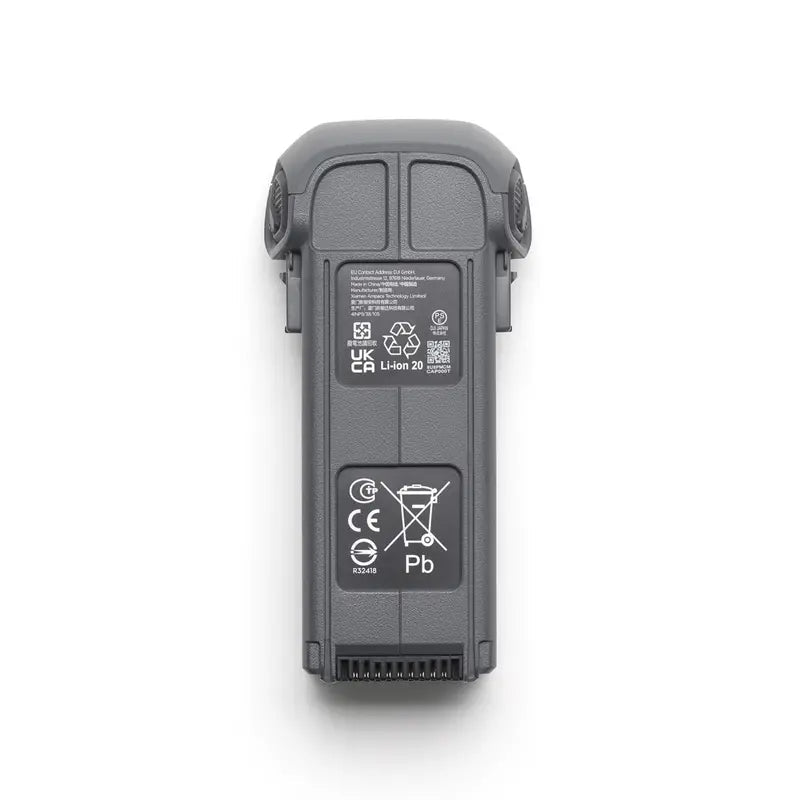 Black electronic device with certification labels on a white background