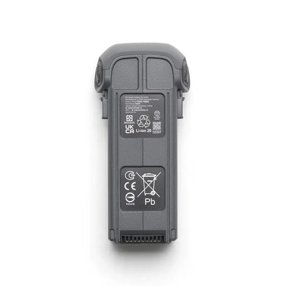 Black electronic device with certification labels on a white background