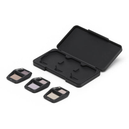 Black camera lens filter set with case on a white background