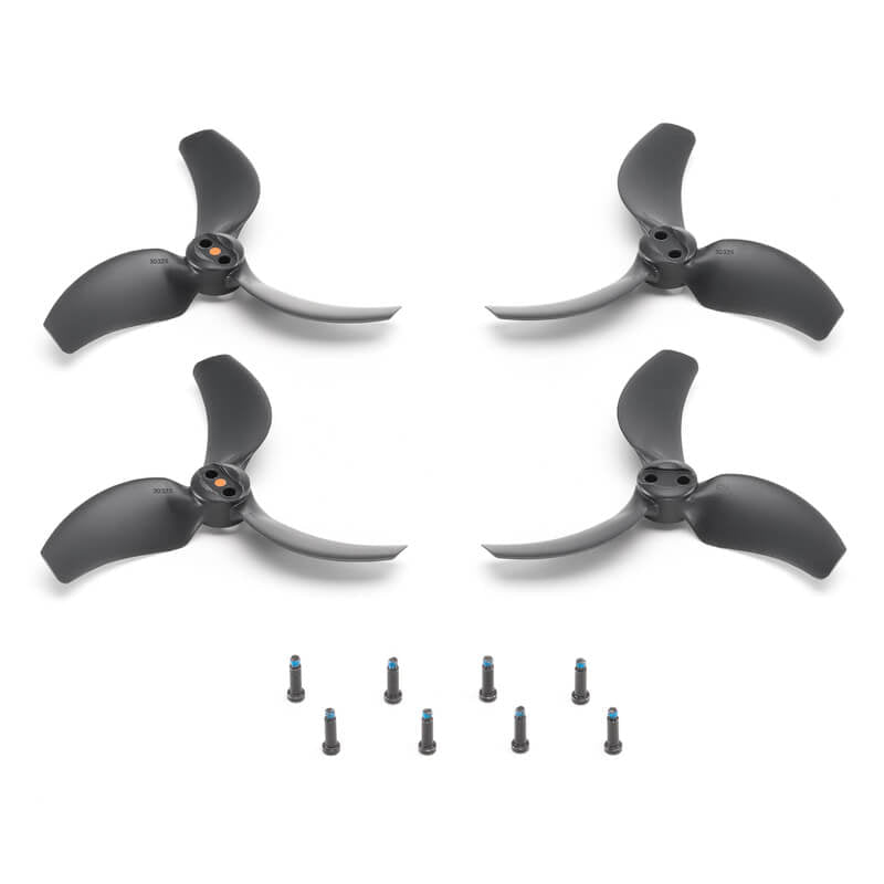 Four black and silver drone propellers with screws on a white background