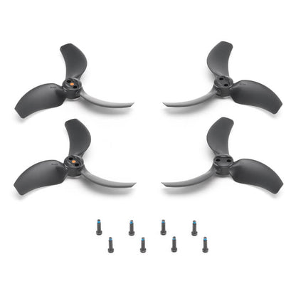Four black and silver drone propellers with screws on a white background