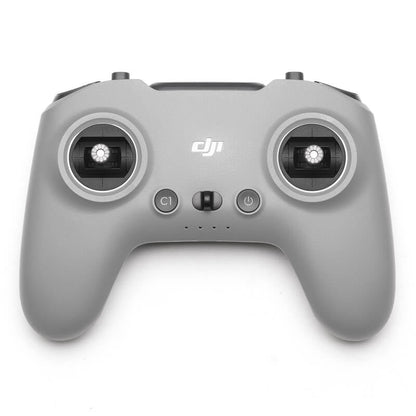 Gray DJI remote control on a white background