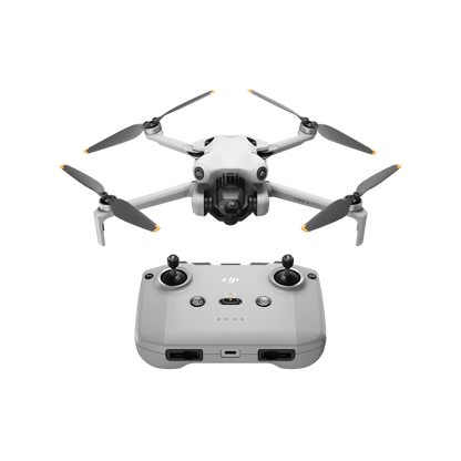 DJI mini 4 pro White drone with propellers and a remote control on a black background