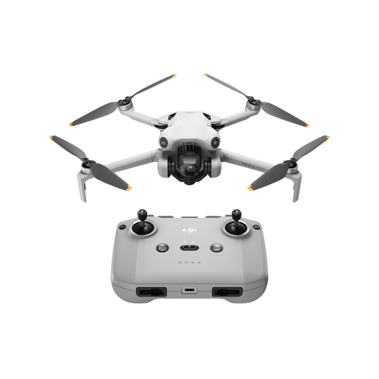 DJI mini 4 pro White drone with propellers and a remote control on a black background