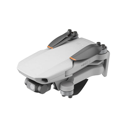 DJI Mini 2 SE drone with folded wings on a white background
