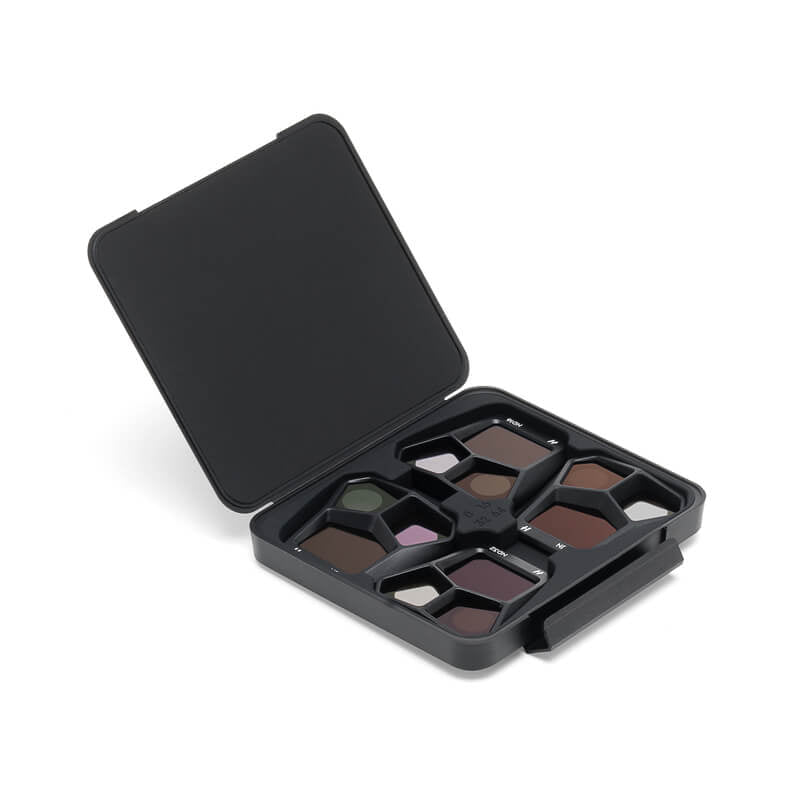 Black makeup palette with open lid on a white background