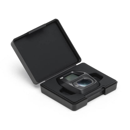 Black camera lens in a protective case on a white background
