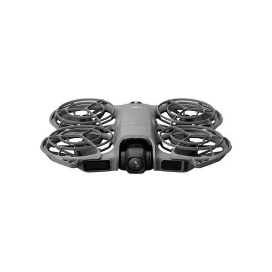 Gray drone with four propellers on a black background