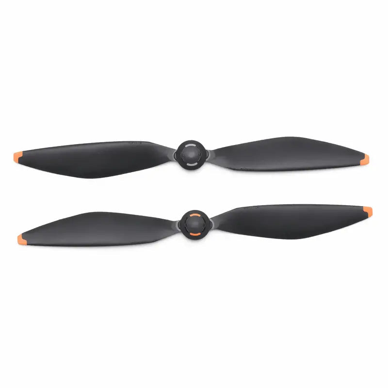 Two black propellers with orange accents on a white background