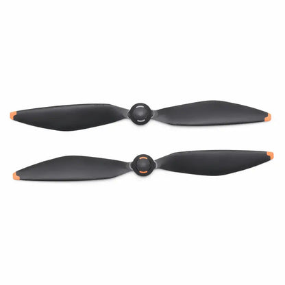Two black propellers with orange accents on a white background
