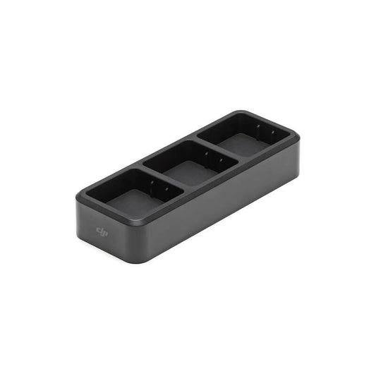 Black rectangular device with three compartments on a white background