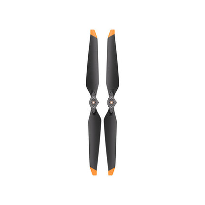 Pair of black propellers with orange tips on a white background