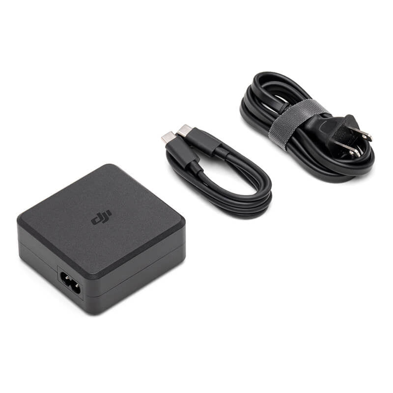 Black power adapter and charging cable on a white background