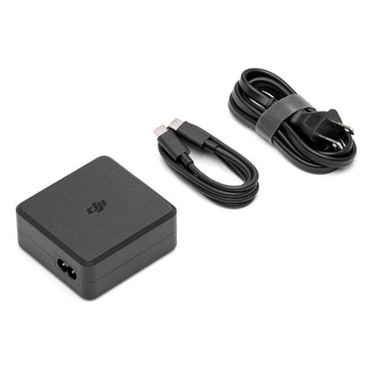 Black power adapter and charging cable on a white background