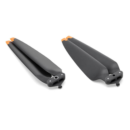 Two black propellers with orange accents on a white background