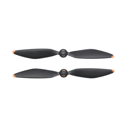 Two black drone propellers on a white background