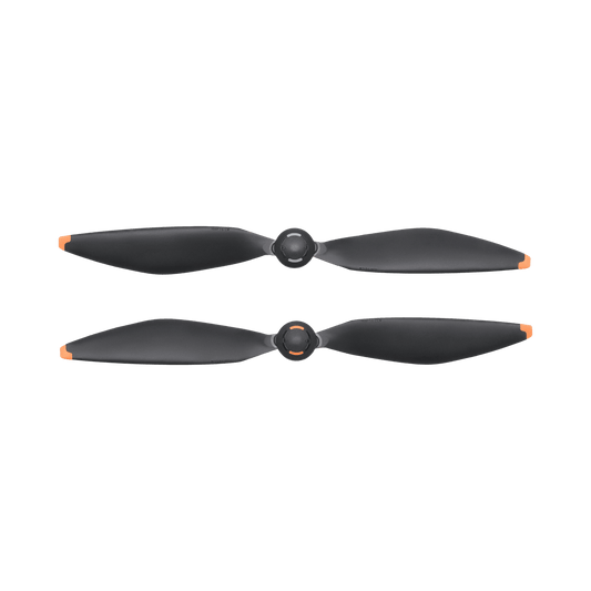 Two black drone propellers on a white background