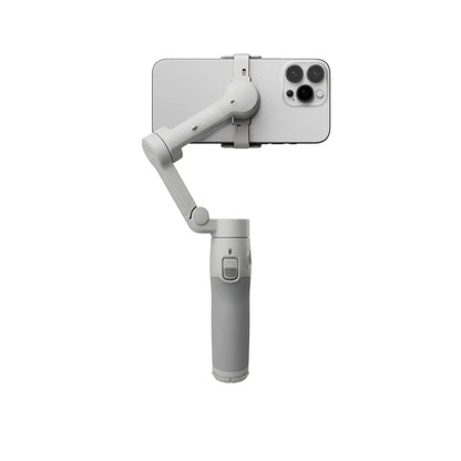 Handheld DJI Osmo Mobile 7 Smartphone Gimbal with phone attached on a white background