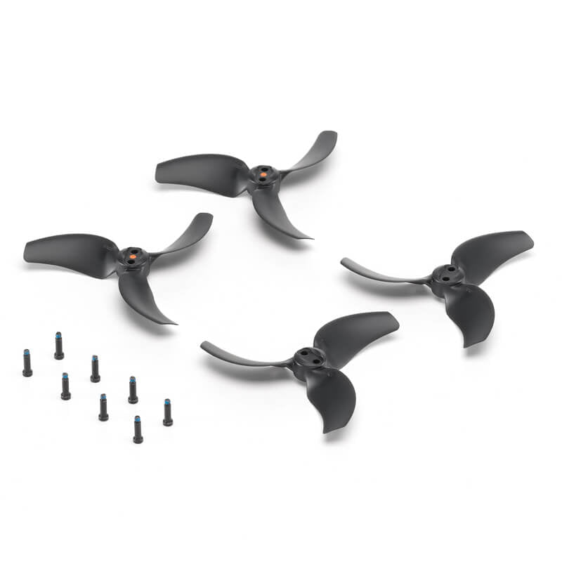 Set of black drone propellers with small screws on a white background