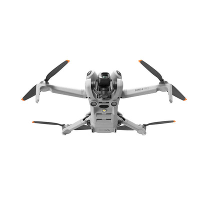 DJI mini 4 pro drone with four propellers on a white background
