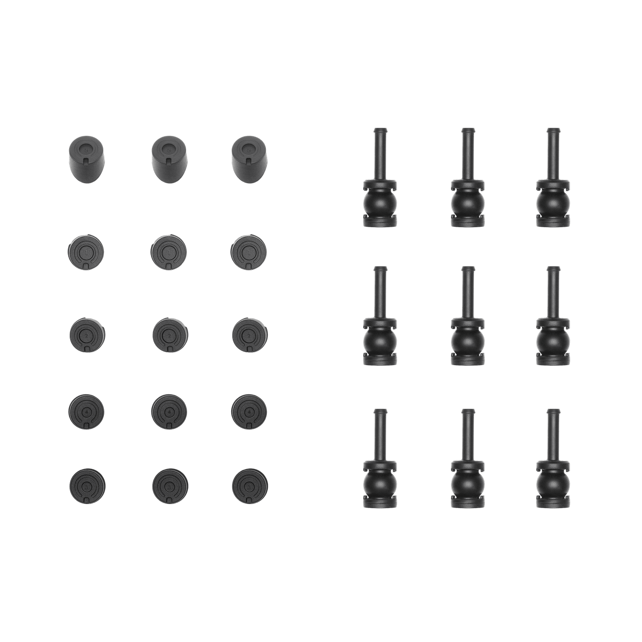 Set of black cylindrical and round objects on a black background