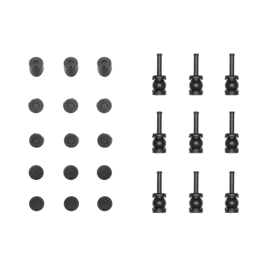 Set of black cylindrical and round objects on a black background