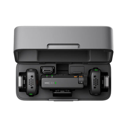 Black DJI Mic Mini electronic device with 'MIC RX' on a white background