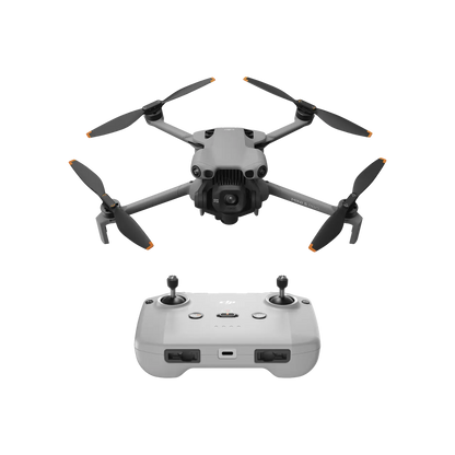 Drone with four propellers and a remote control on a white background