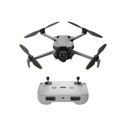 Drone with four propellers and a remote control on a white background