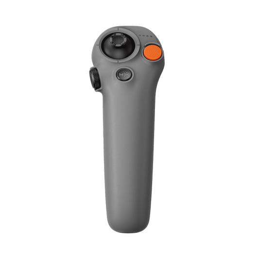 Gray handheld device with a black wheel and orange button on a white background